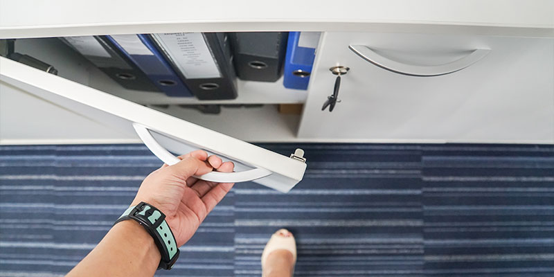 Hand opening locked drawer