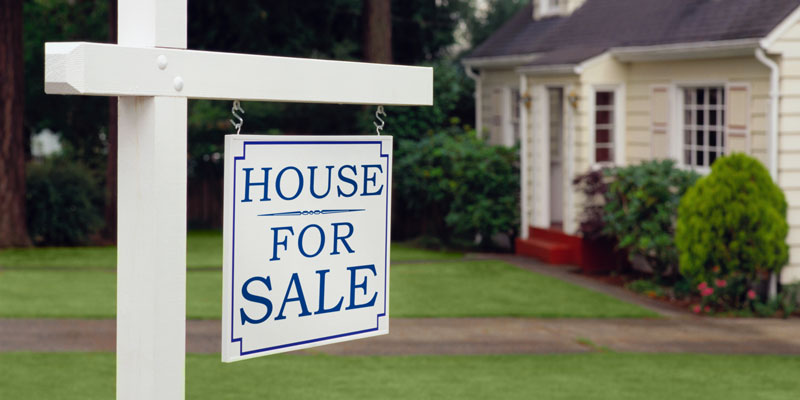House with for sale sign