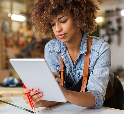 woman using Quick Pay on tablet to make a payment