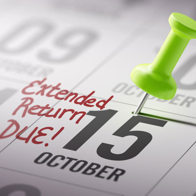 Calendar with pushpin on October 15 extension due date