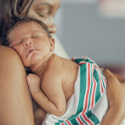 mother holding newborn baby