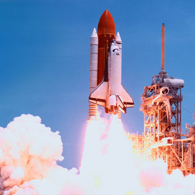 Space shuttle taking off