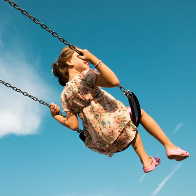 little girl on a swing